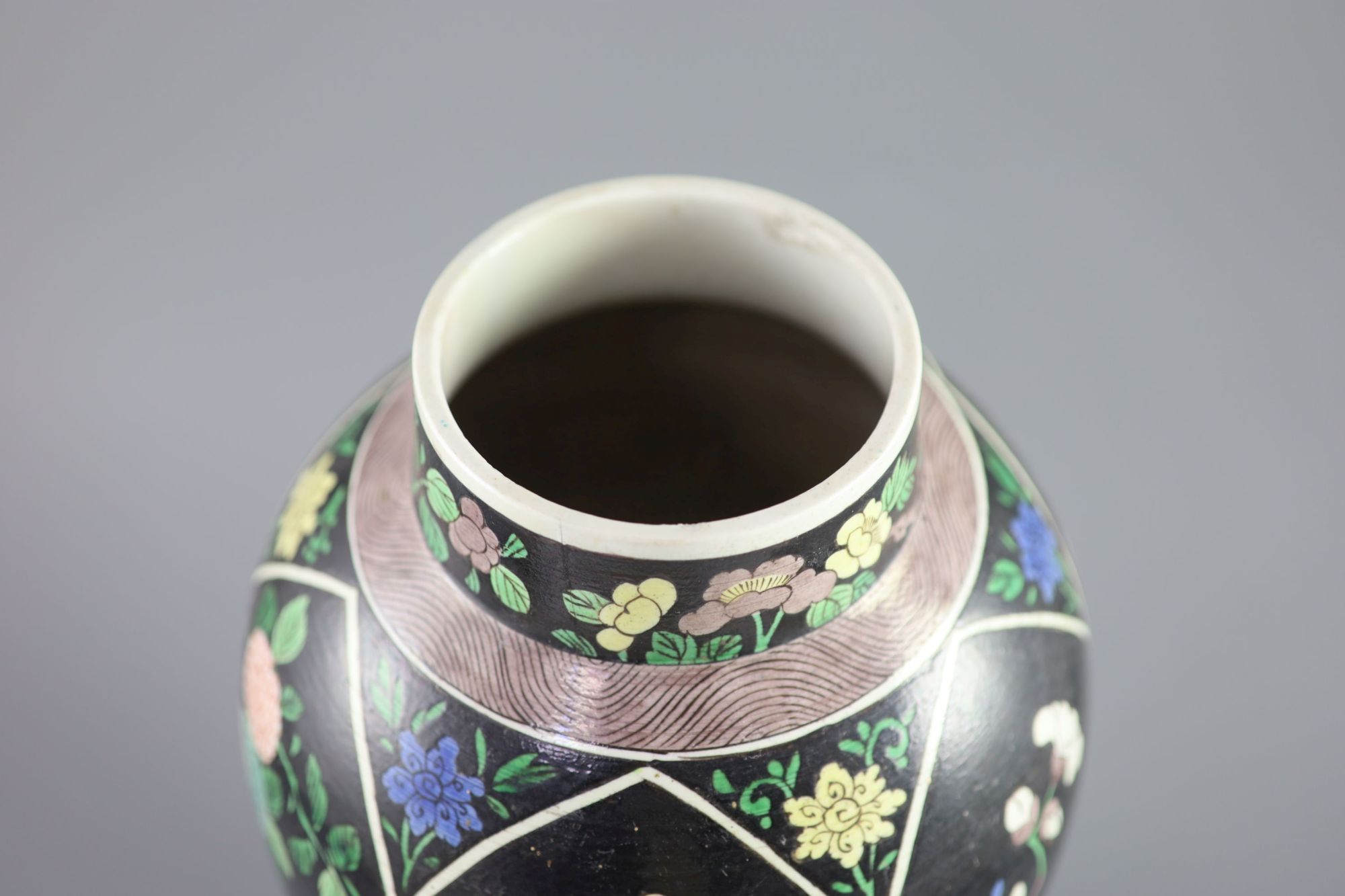 A Chinese famille noire enamelled biscuit baluster vase and cover, 19th century, 47cm high